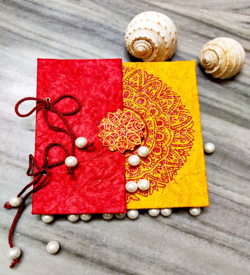 handmade diary red and yellow color with rangoli design