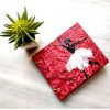 handmade diary with a dancing doll painting on red cover