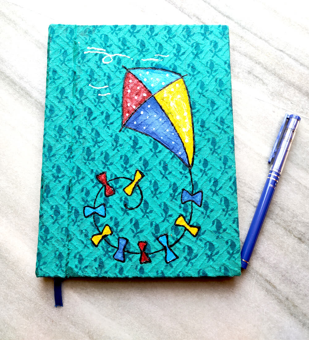 handmade diary with hand-painted kite design on cover